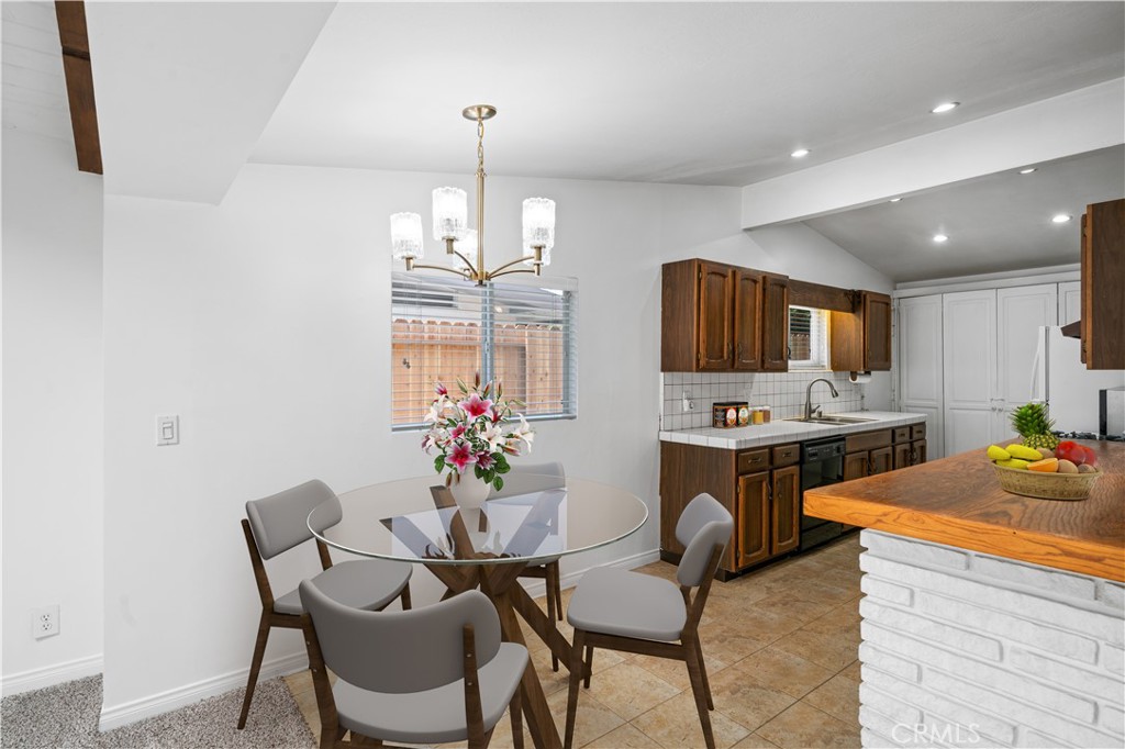 2115 Sterling Avenue Costa Mesa, CA 92627 - Photo 23 of 53 a view of a dining room with furniture