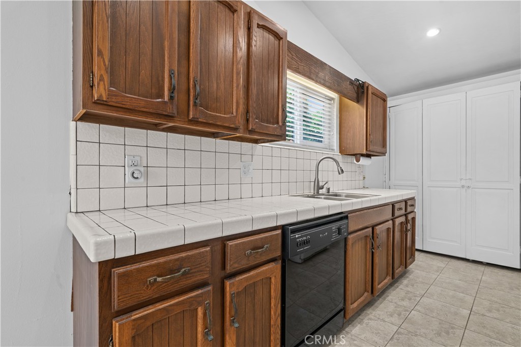 2115 Sterling Avenue Costa Mesa, CA 92627 - Photo 28 of 53 a kitchen with stainless steel appliances granite countertop a sink stove and cabinets