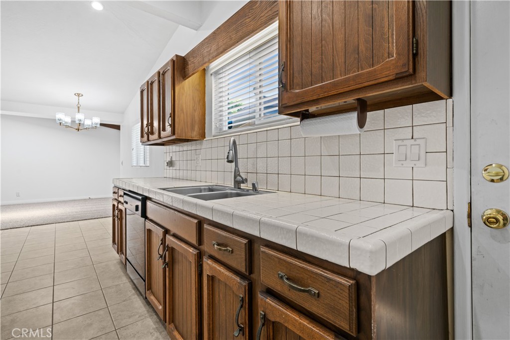 2115 Sterling Avenue Costa Mesa, CA 92627 - Photo 30 of 53 a kitchen with a sink stove and cabinets