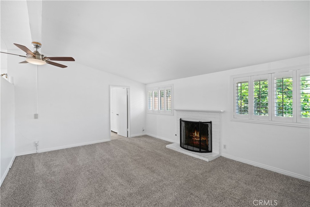 2115 Sterling Avenue Costa Mesa, CA 92627 - Photo 33 of 53 a view of a livingroom with a fireplace and a window