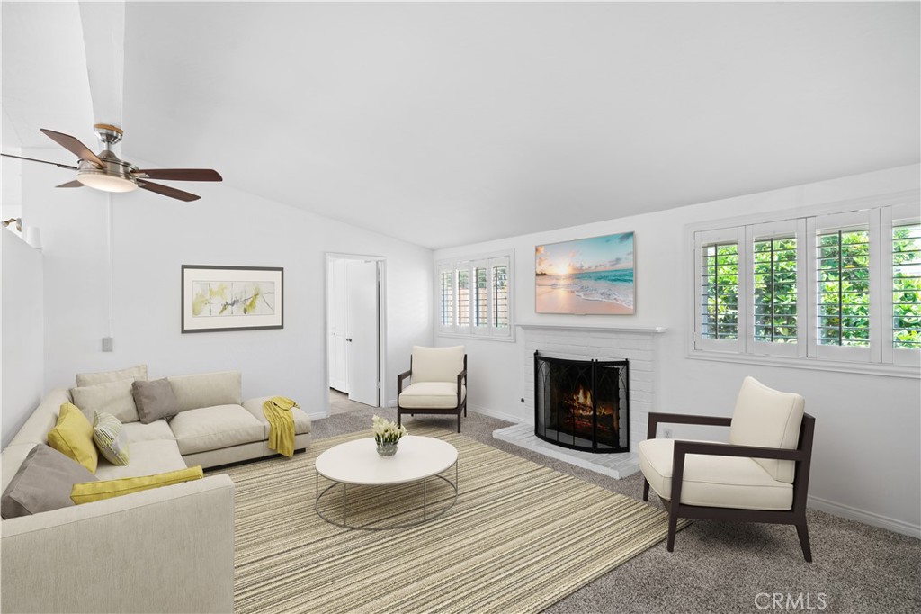 2115 Sterling Avenue Costa Mesa, CA 92627 - Photo 34 of 53 a living room with furniture and a fireplace