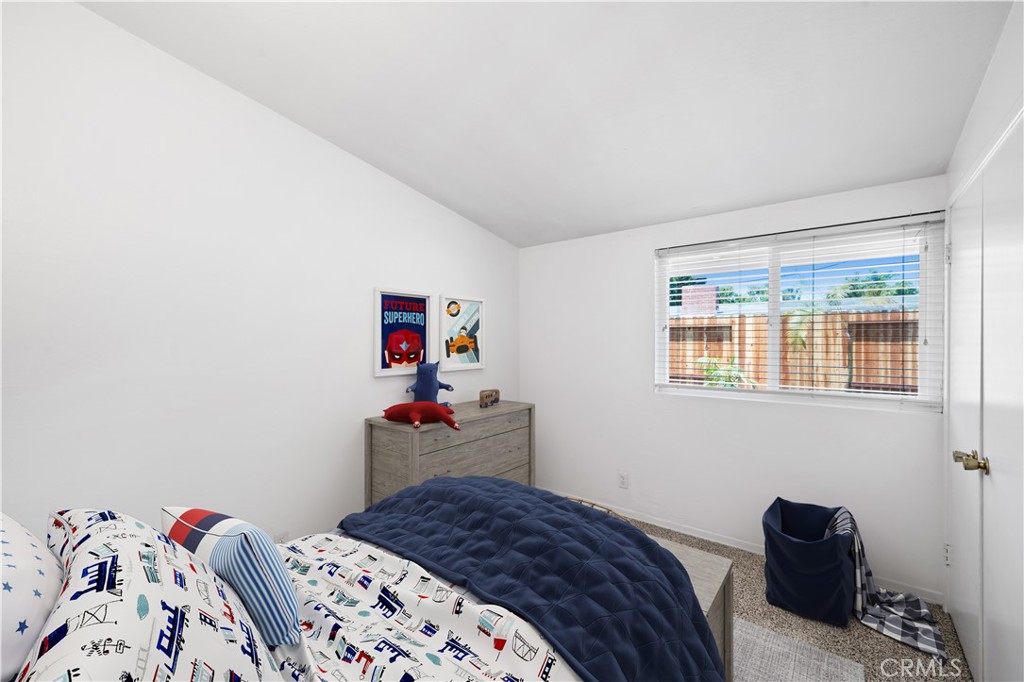 2115 Sterling Avenue Costa Mesa, CA 92627 - Photo 39 of 53 a bedroom with a bed and a window