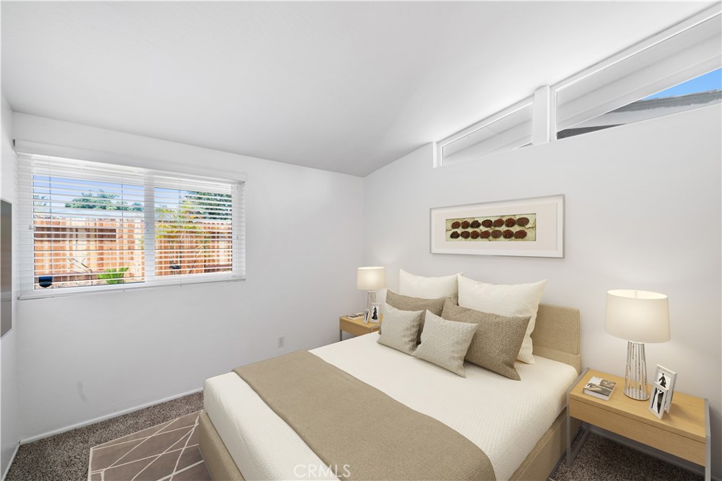 2115 Sterling Avenue Costa Mesa, CA 92627 - Photo 41 of 53 a bedroom with a bed and a lamp