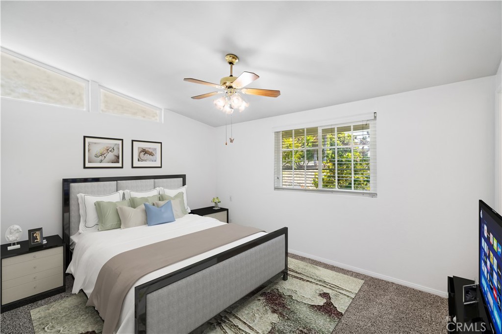 2115 Sterling Avenue Costa Mesa, CA 92627 - Photo 43 of 53 a bedroom with a bed and a chandelier