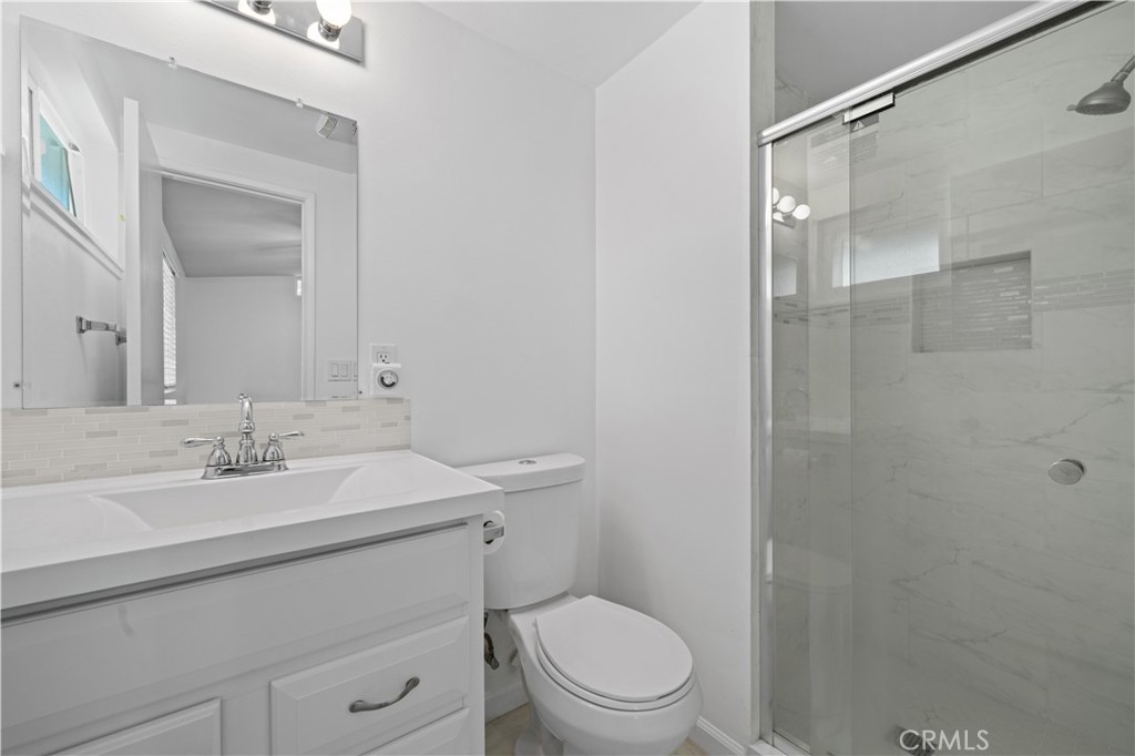 2115 Sterling Avenue Costa Mesa, CA 92627 - Photo 46 of 53 a bathroom with a sink toilet vanity and shower
