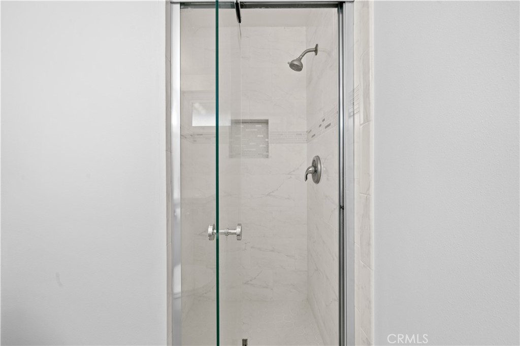 2115 Sterling Avenue Costa Mesa, CA 92627 - Photo 47 of 53 a bathroom with a glass shower door