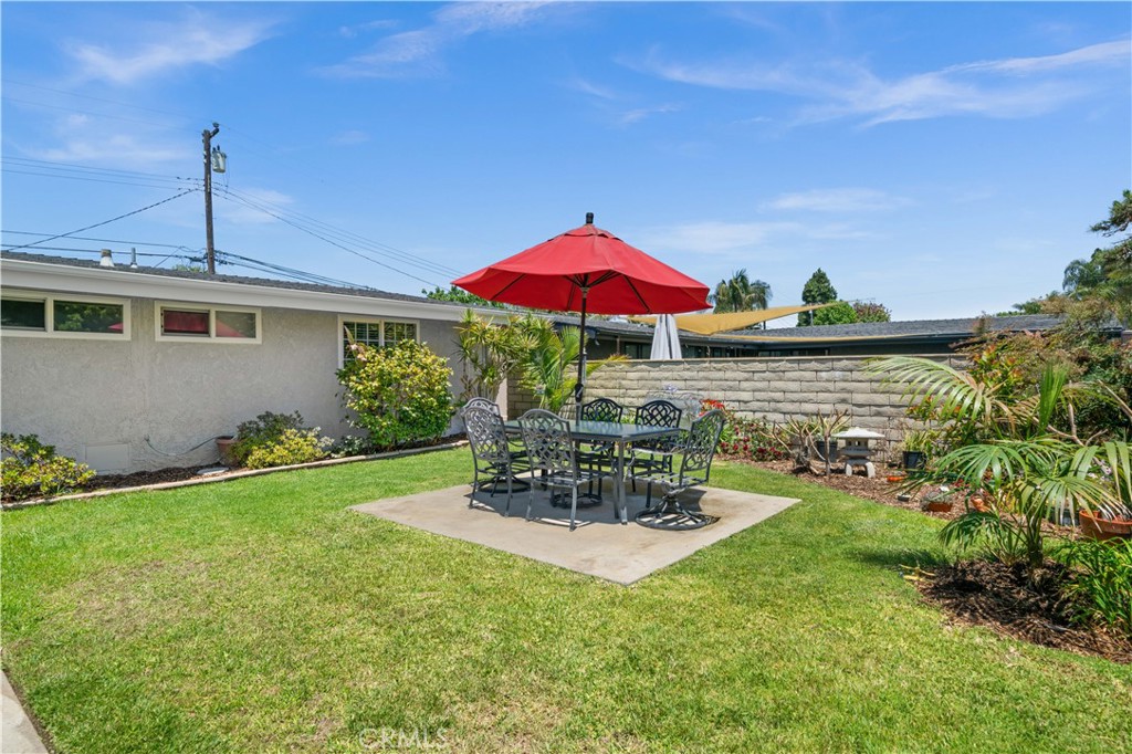 2115 Sterling Avenue Costa Mesa, CA 92627 - Photo 5 of 53 a view of a house with patio and a garden