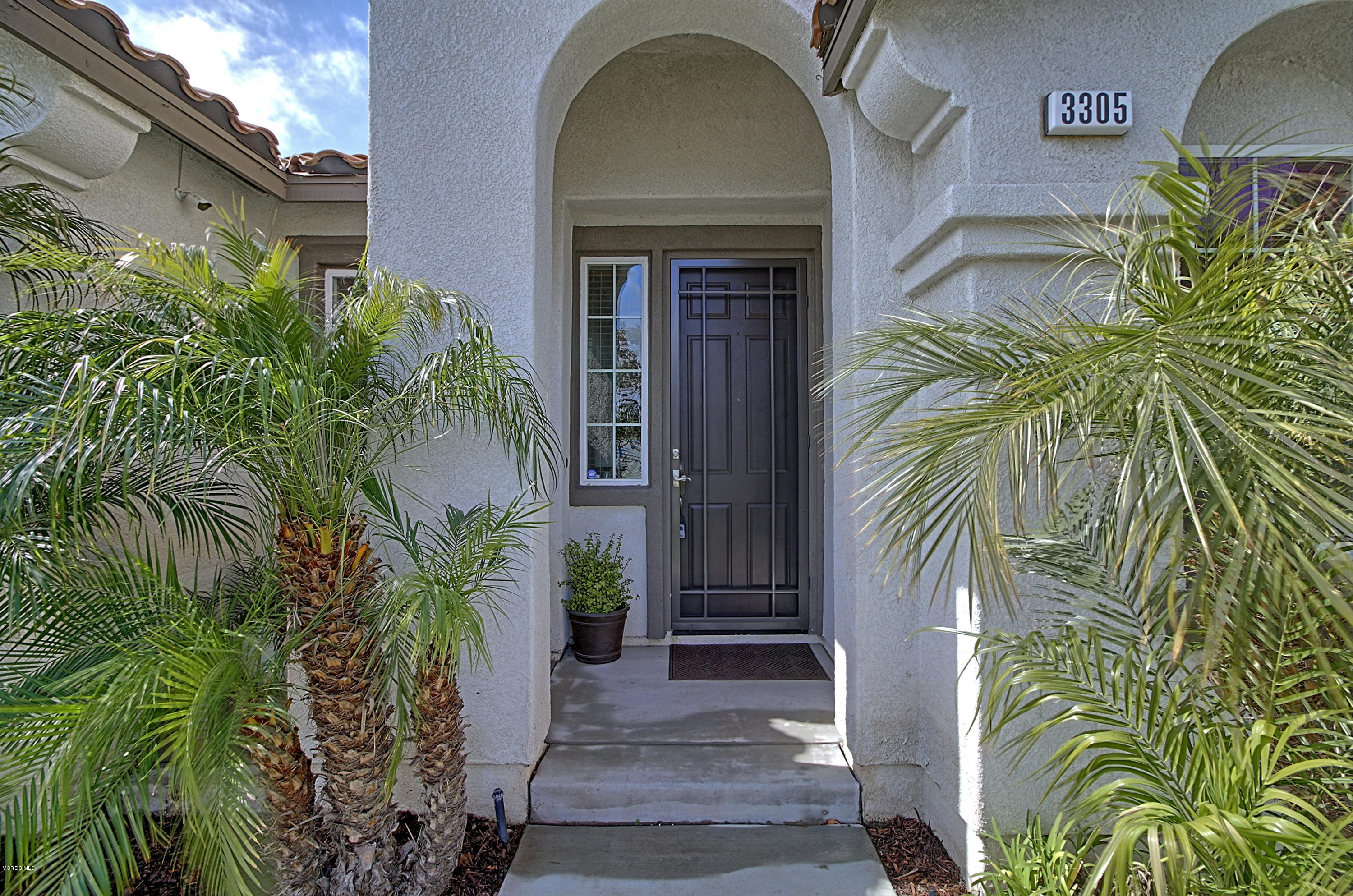 3305 Dunkirk Drive Oxnard, CA 93035 - Photo 2 of 20 a view of a door and small garden