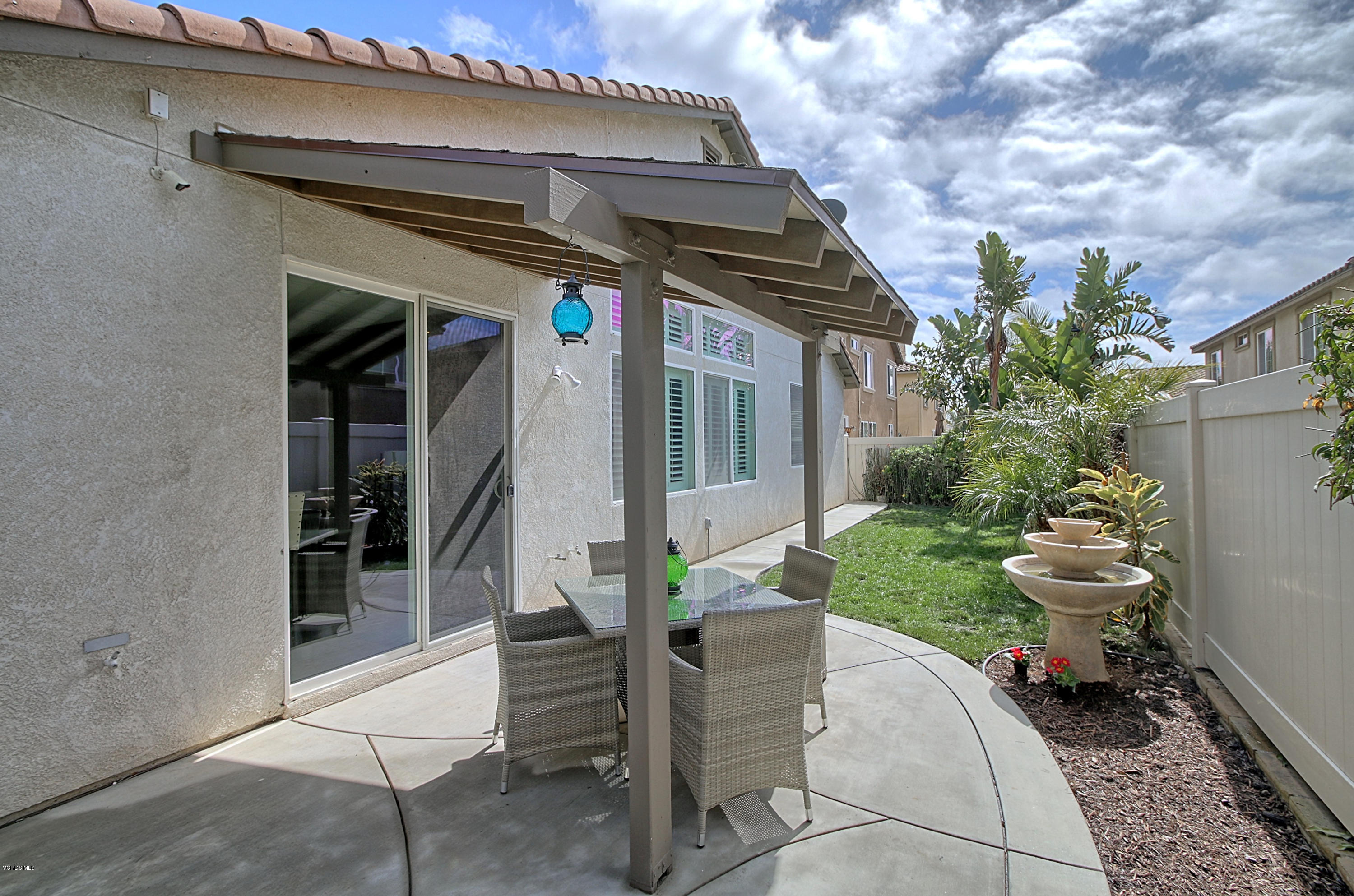 3305 Dunkirk Drive Oxnard, CA 93035 - Photo 19 of 20 a view of house with backyard outdoor seating and green space