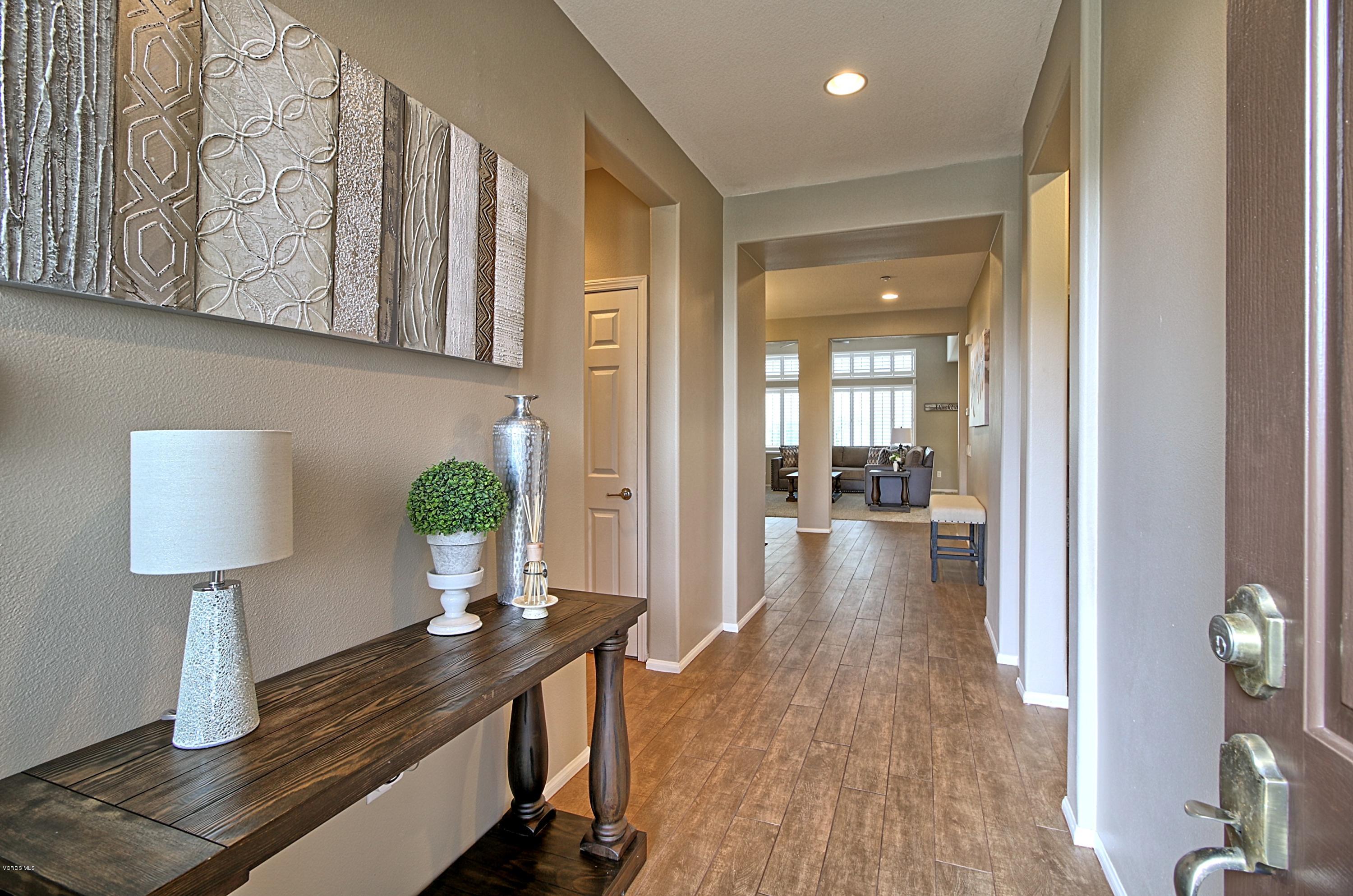 3305 Dunkirk Drive Oxnard, CA 93035 - Photo 3 of 20 a view of a hallway view with wooden floor and furniture