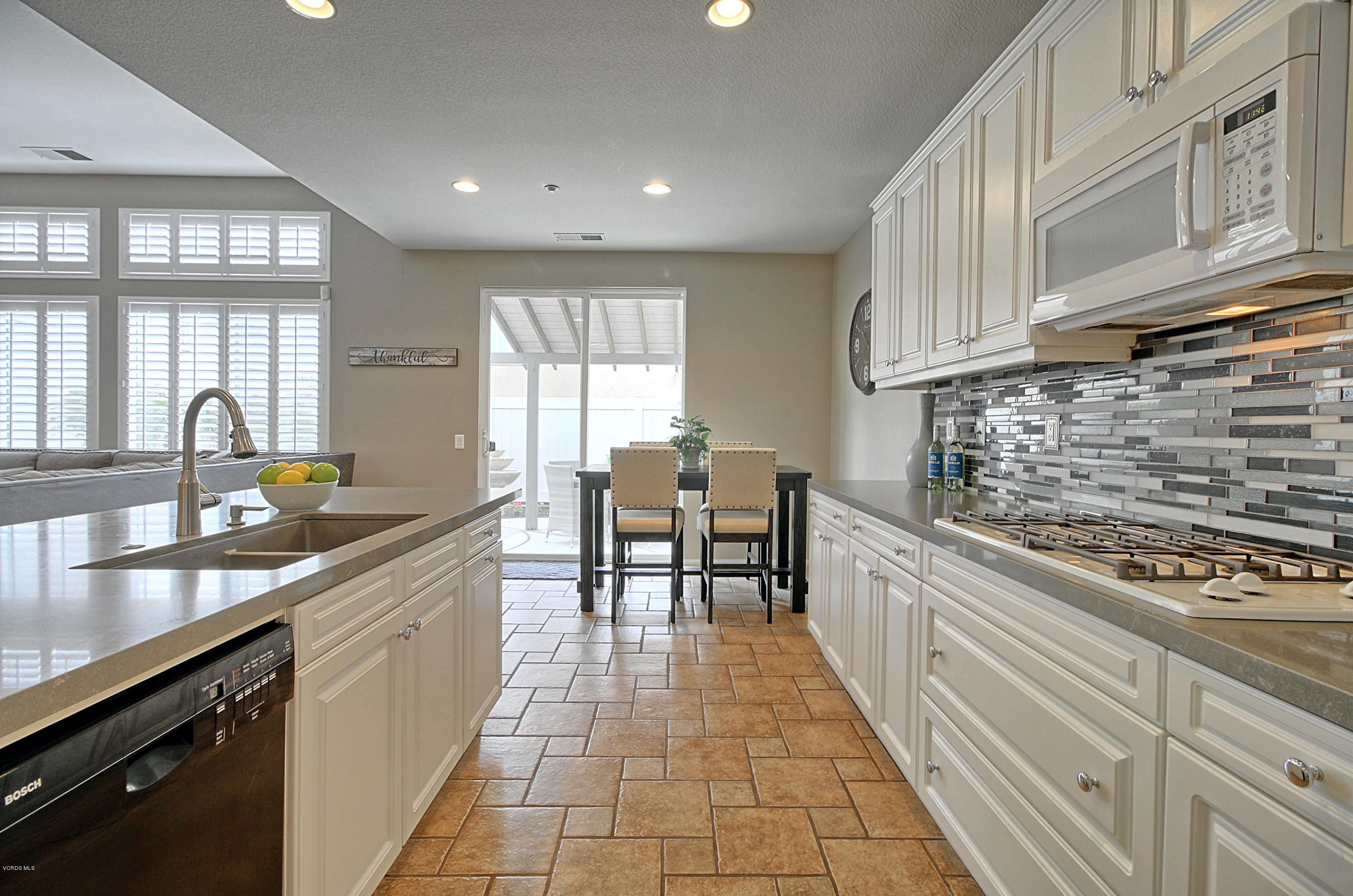 3305 Dunkirk Drive Oxnard, CA 93035 - Photo 9 of 20 a kitchen with stainless steel appliances granite countertop a sink and cabinets