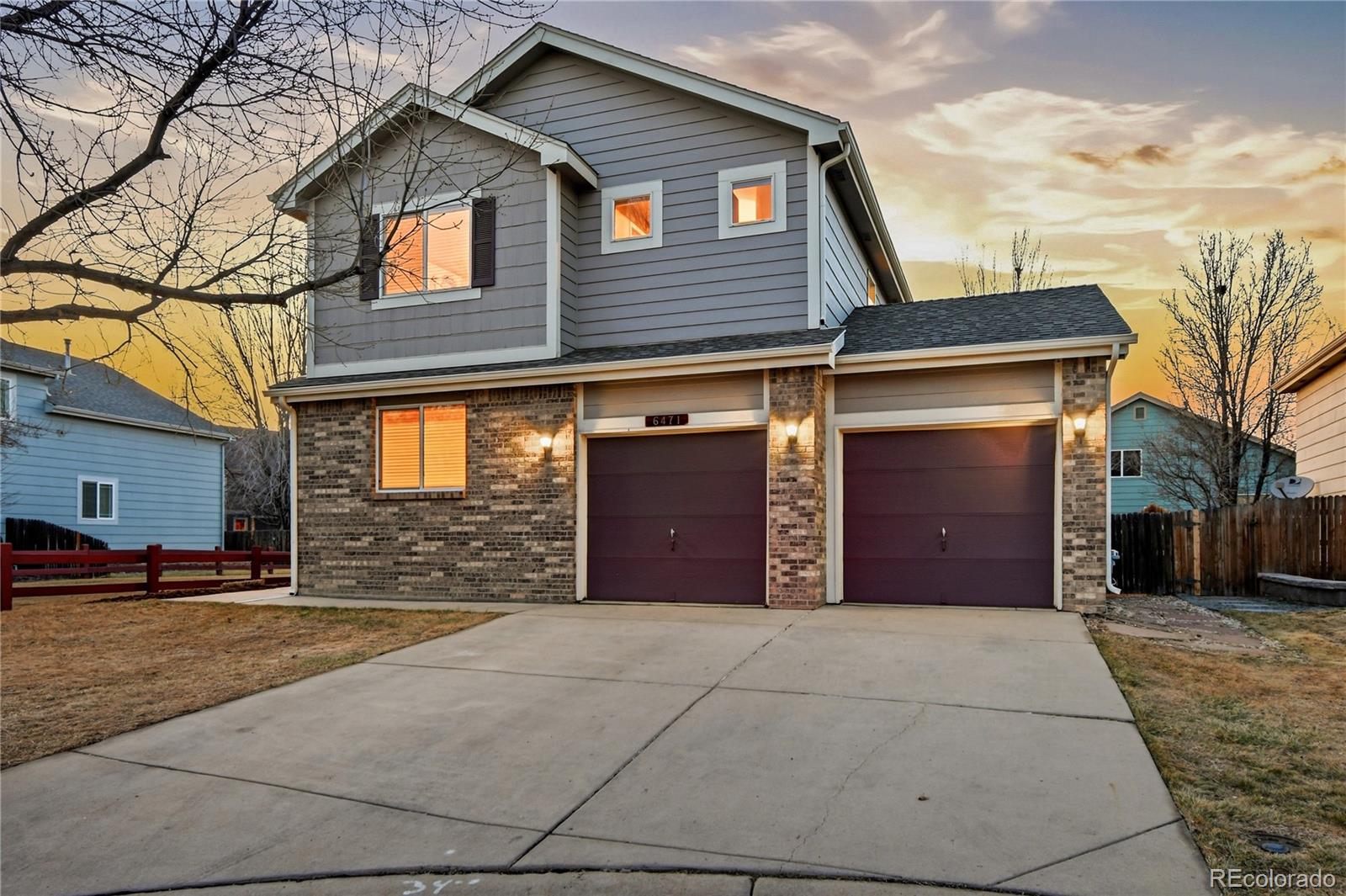 6471 St Vrain Ranch Boulevard Firestone, CO 80504 - Photo 1 of 45 a front view of a house with a yard and garage