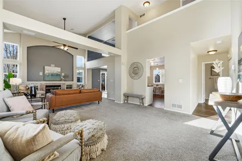 a bedroom with furniture and a large window