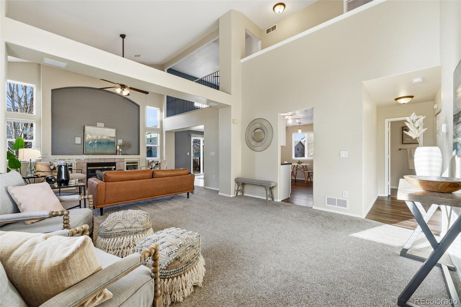6471 St Vrain Ranch Boulevard Firestone, CO 80504 - Photo 2 of 45 a bedroom with furniture and a large window