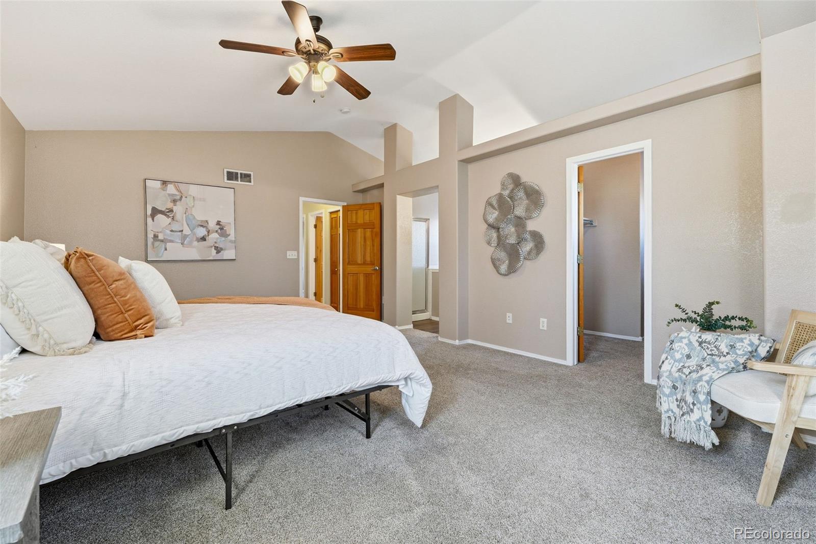 6471 St Vrain Ranch Boulevard Firestone, CO 80504 - Photo 28 of 45 a bedroom with a bed couch and window