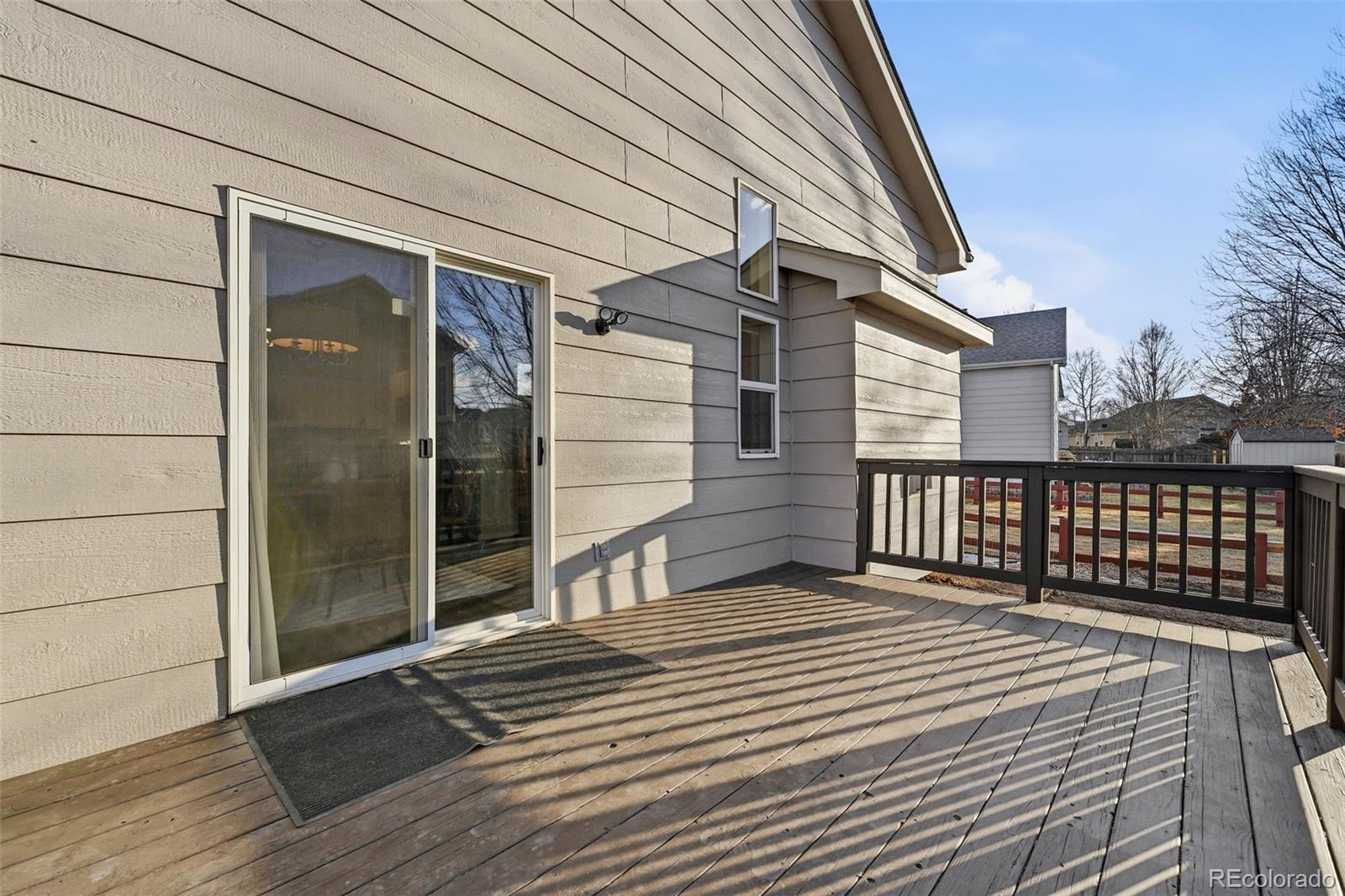 6471 St Vrain Ranch Boulevard Firestone, CO 80504 - Photo 40 of 45 a balcony view with a glass door