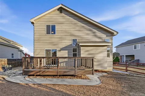 a view of house with a yard