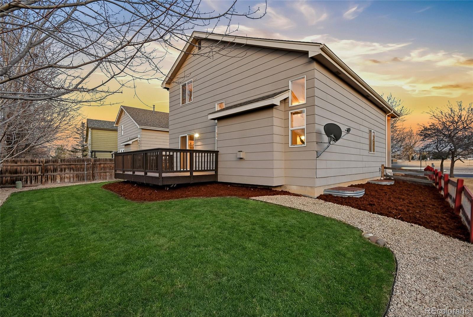 6471 St Vrain Ranch Boulevard Firestone, CO 80504 - Photo 43 of 45 a view of backyard with a garden