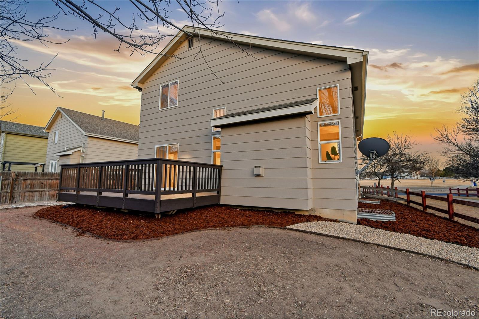6471 St Vrain Ranch Boulevard Firestone, CO 80504 - Photo 44 of 45 a view of a house with a yard and roof
