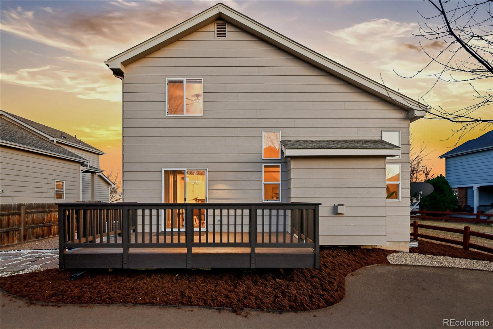 6471 St Vrain Ranch Boulevard Firestone, CO 80504 - Photo 45 of 45 a view of a house with a deck