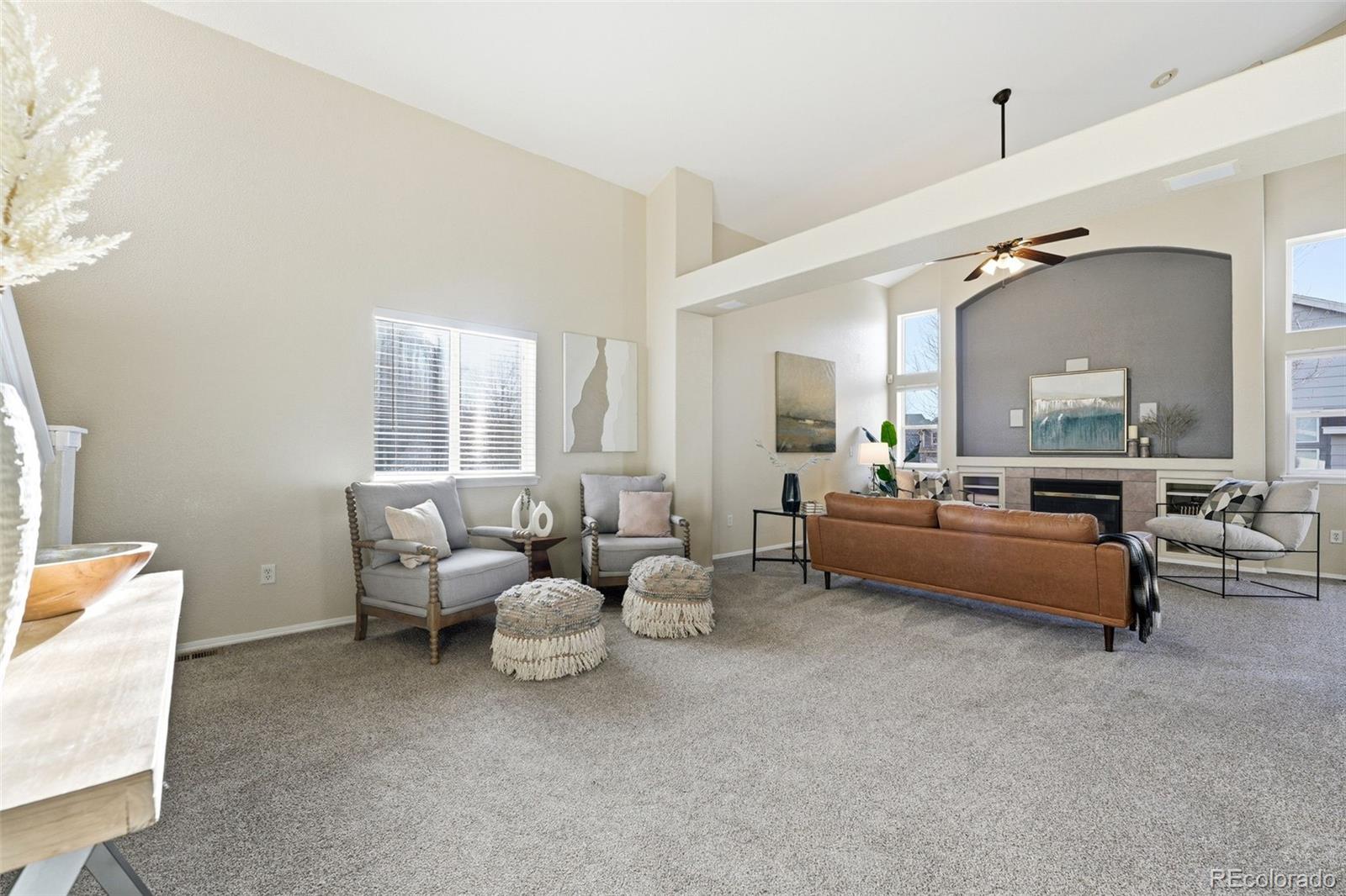 6471 St Vrain Ranch Boulevard Firestone, CO 80504 - Photo 7 of 45 a living room with furniture and a large window