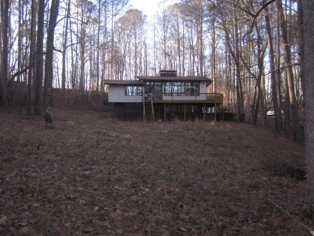 1015 Iron Mountain Road Canton, GA 30115 - Photo 8 of 24 a view of house with trees in front of it