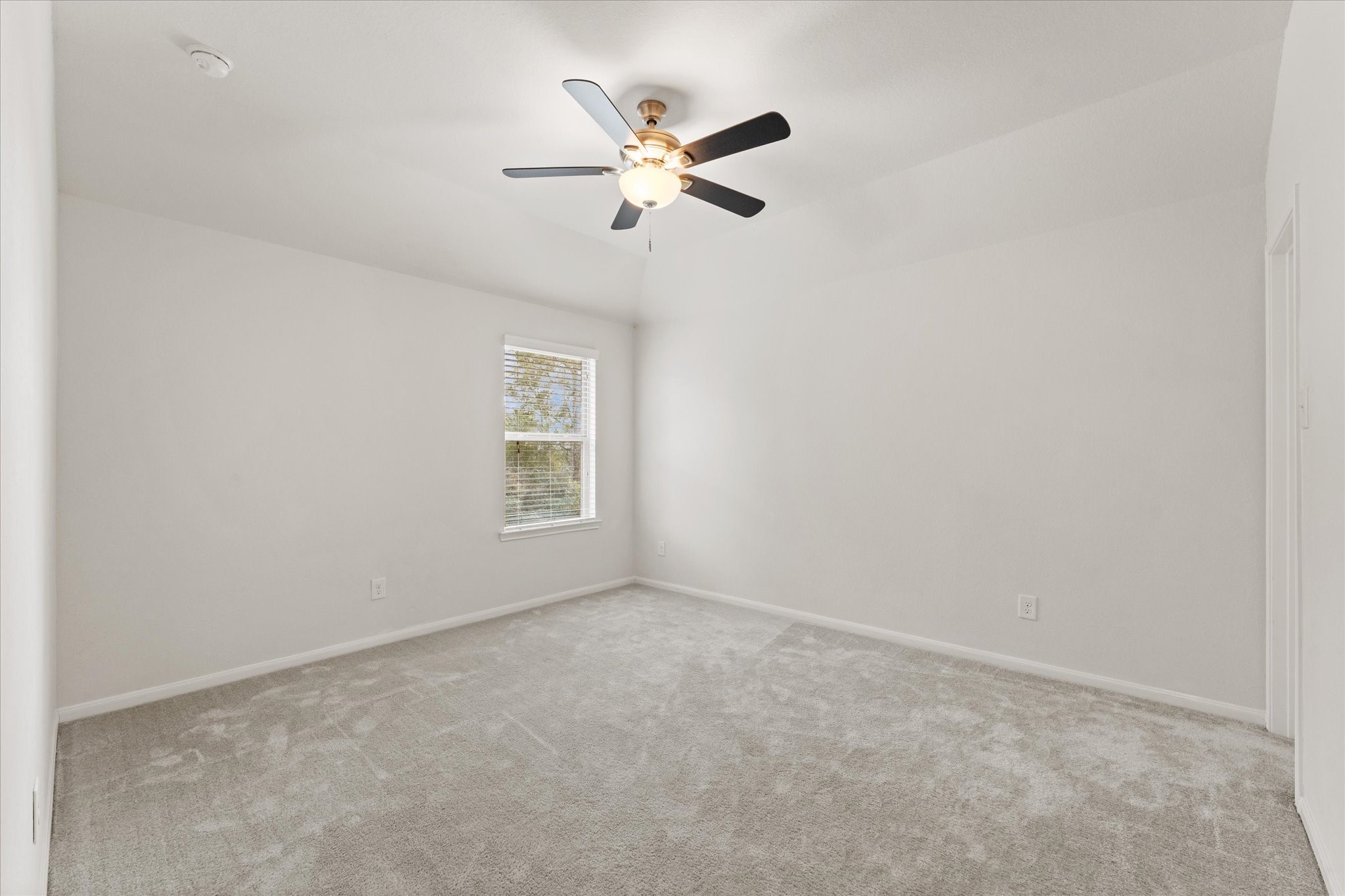 3402 Dryer Park Drive Spring, TX 77373 - Photo 29 of 40 Bright and spacious third bedroom with soft carpeting, perfect for comfort and relaxation.