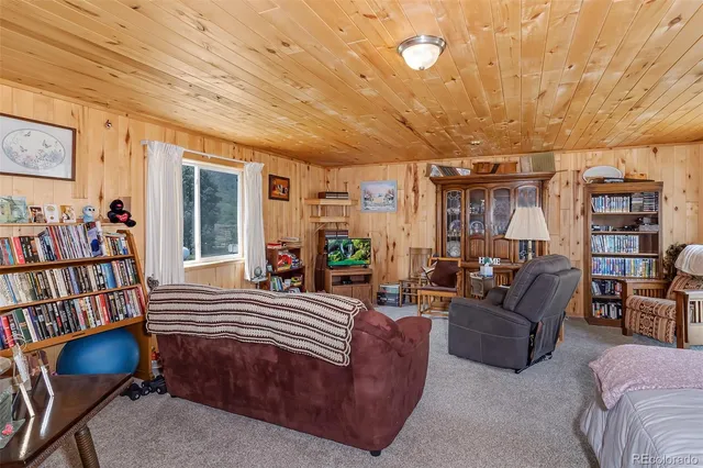 a bedroom with a bed and a table in it