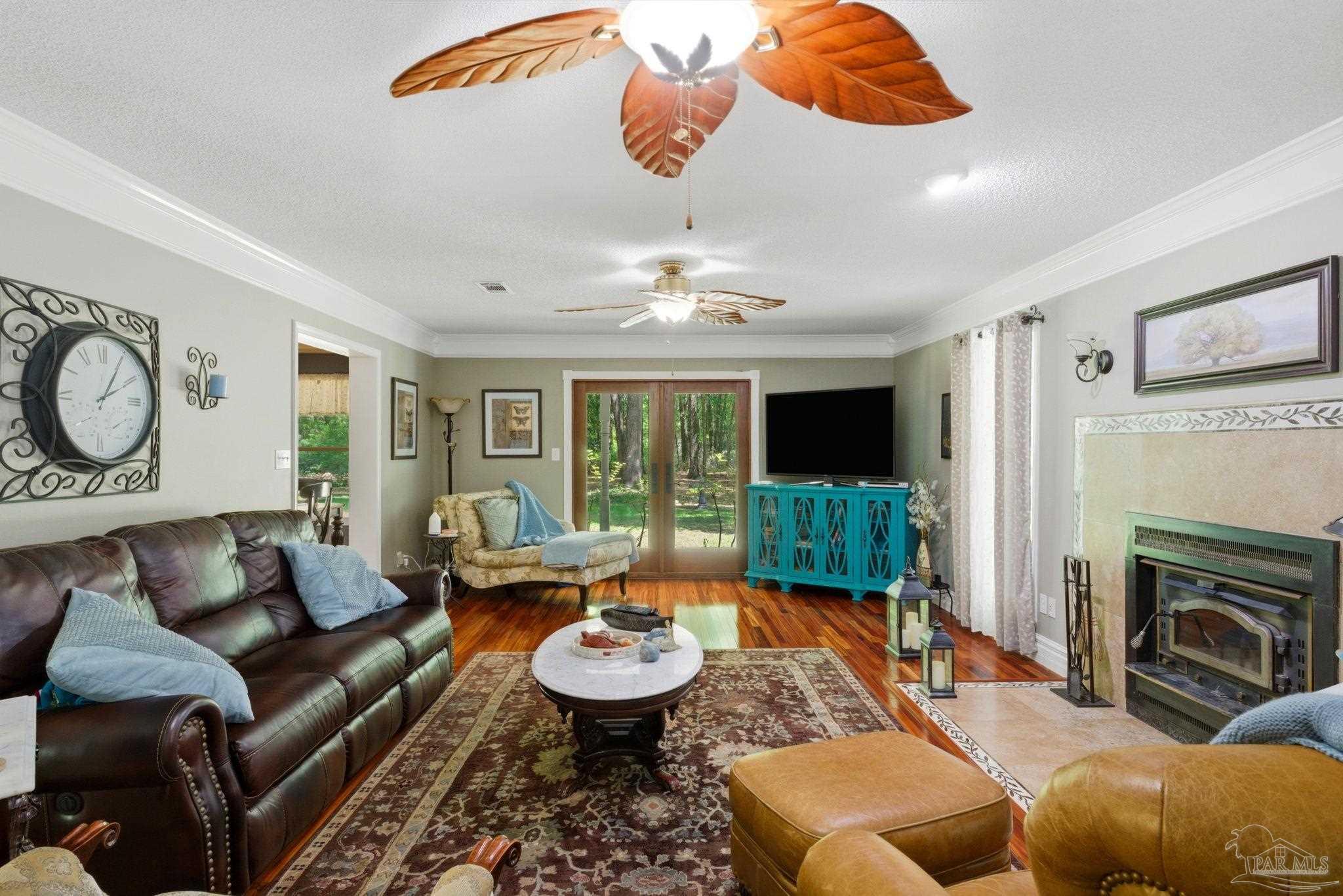 6930 Summit Way Milton, FL 32570 - Photo 9 of 71 a living room with furniture and a fireplace
