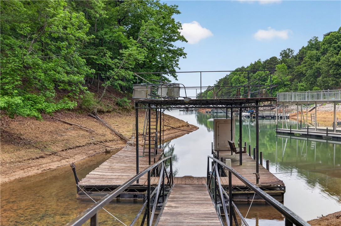 206 James Hare Road Anderson, SC 29626 - Photo 9 of 37 Boasting direct access to the water, this property features a private boat dock with an inviting lakeside view.