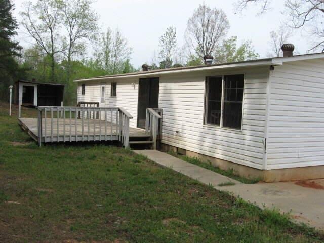 789 Garnett Ward Road Hull, GA 30646 - Photo 1 of 1 a view of a house with a yard and deck