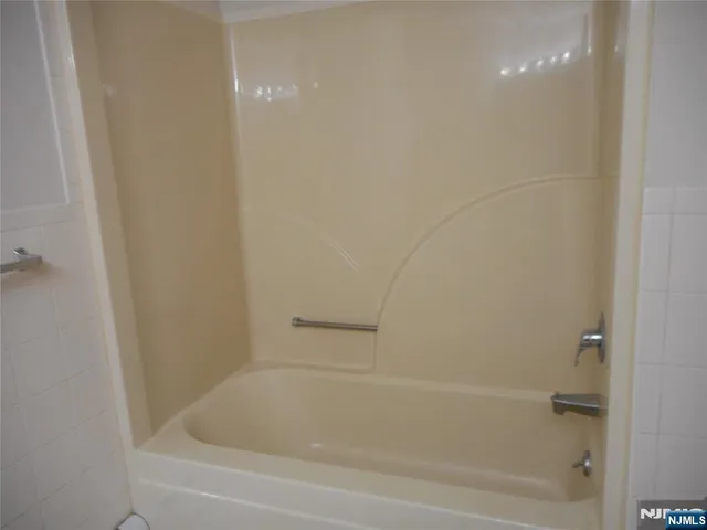 a close view of a bathtub in bathroom