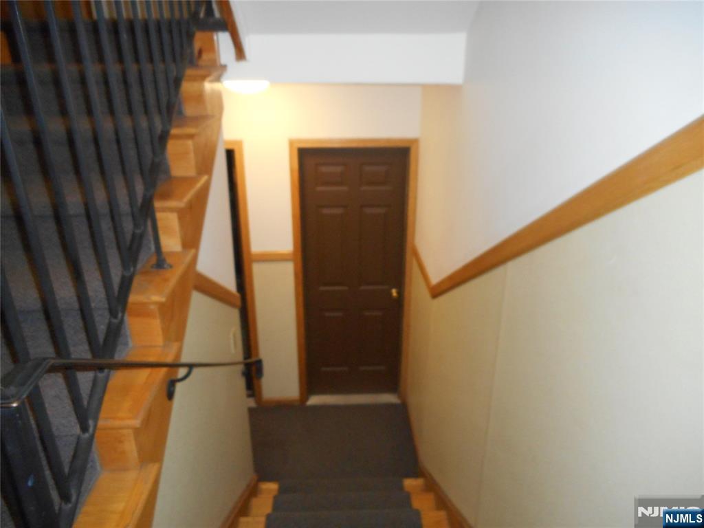 129 River Road, Unit 129 Clifton, NJ 07014 - Photo 18 of 21 a view of walk in closet with clothes