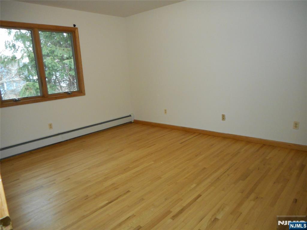 129 River Road, Unit 129 Clifton, NJ 07014 - Photo 10 of 21 an empty room with a window