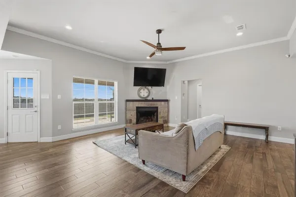 a living room with furniture fireplace and flat screen tv