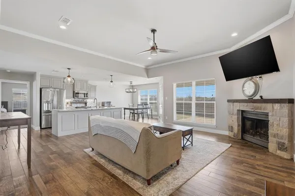 a bedroom with a bed and a ceiling fan