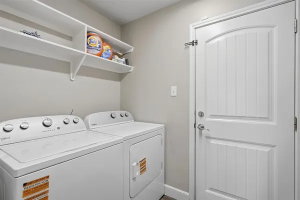 a bed room with a bed and a television