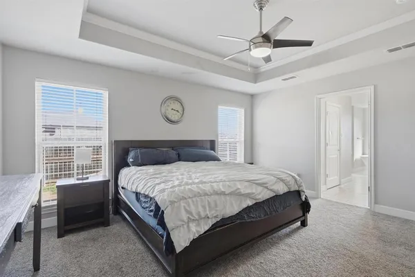 a bedroom with a bed and a chair