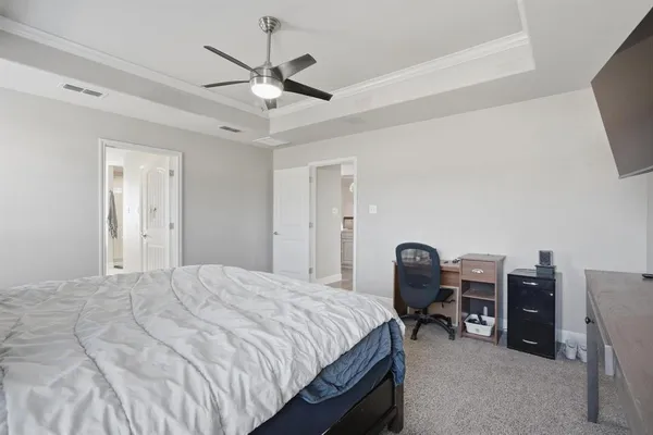 a spacious bathroom with a bathtub and toilet
