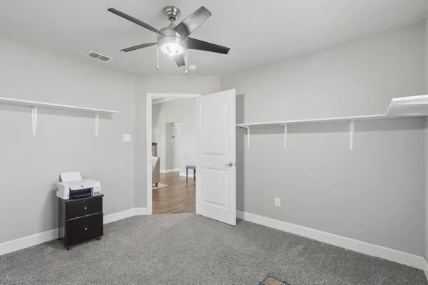 a view of yard with wooden fence