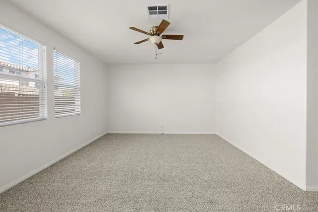 a large kitchen with cabinets and stainless steel appliances