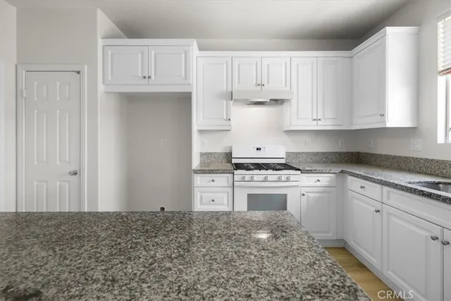 a view of a room with a ceiling fan