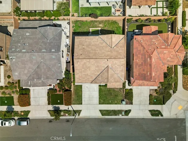 an aerial view of houses with outdoor space