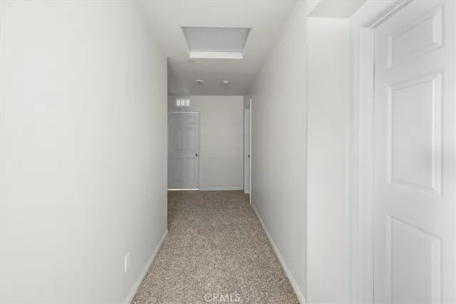 a view of a hallway with a white walls