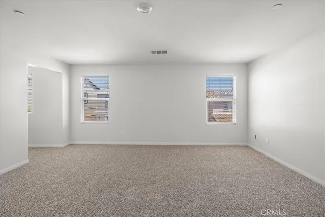 a view of a hallway with windows