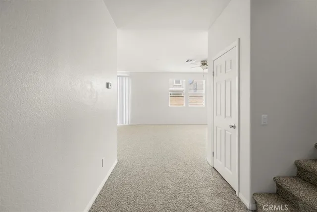 a view of a hallway with staircase