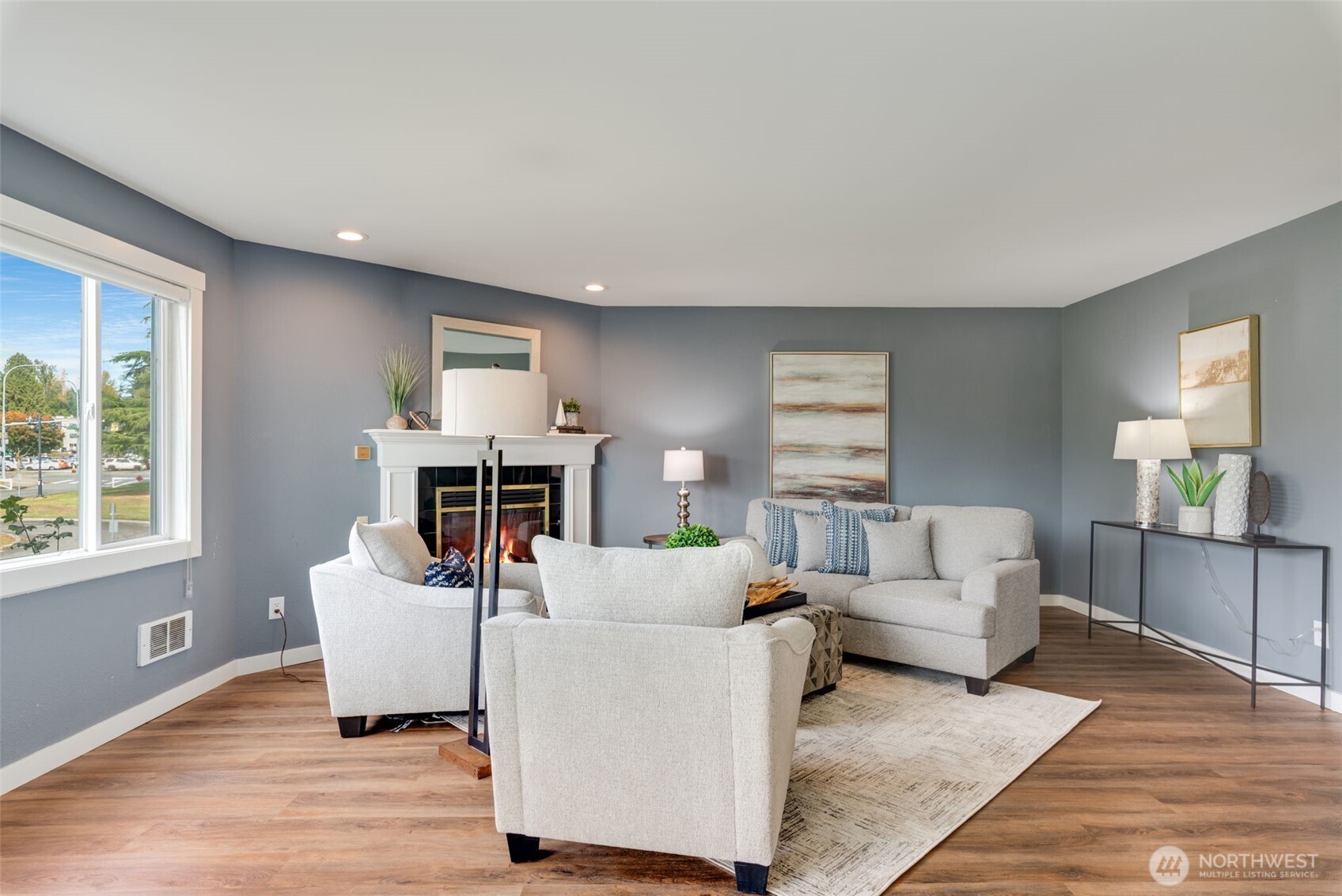 9715 Northeast Juanita Drive, Unit 206B Kirkland, WA 98034 - Photo 15 of 39 a living room with furniture and a fireplace