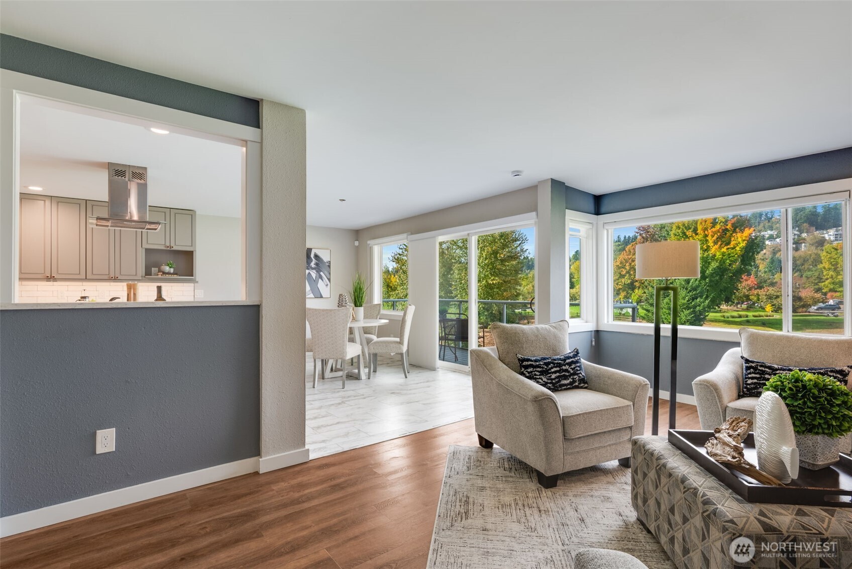 9715 Northeast Juanita Drive, Unit 206B Kirkland, WA 98034 - Photo 16 of 39 a living room with furniture and a large window