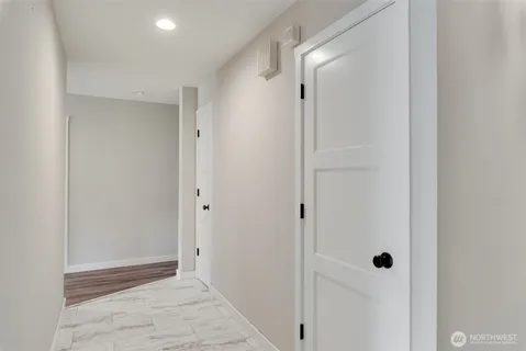 a view of storage and utility room with washer and dryer