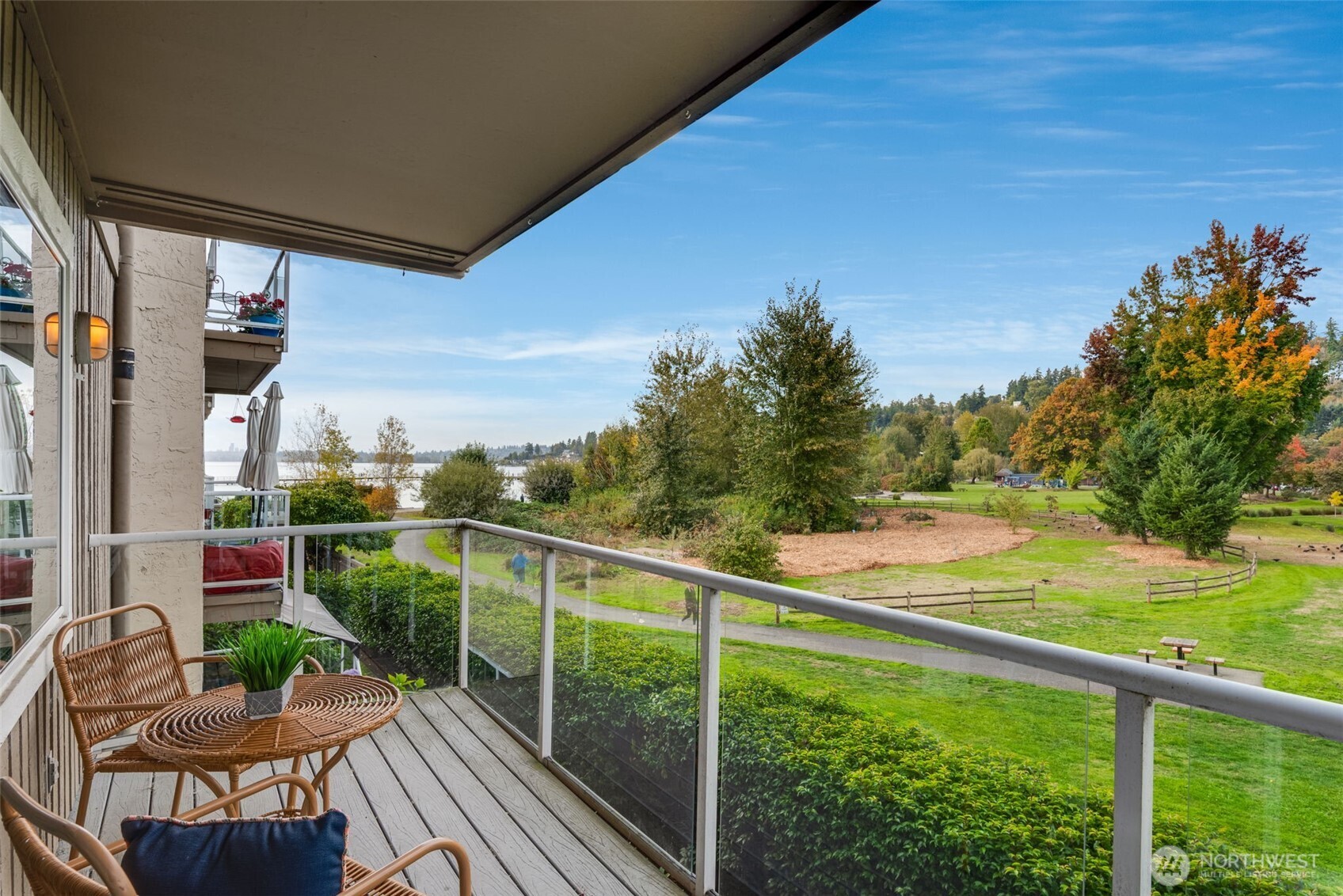 9715 Northeast Juanita Drive, Unit 206B Kirkland, WA 98034 - Photo 2 of 39 a view of a balcony with chairs